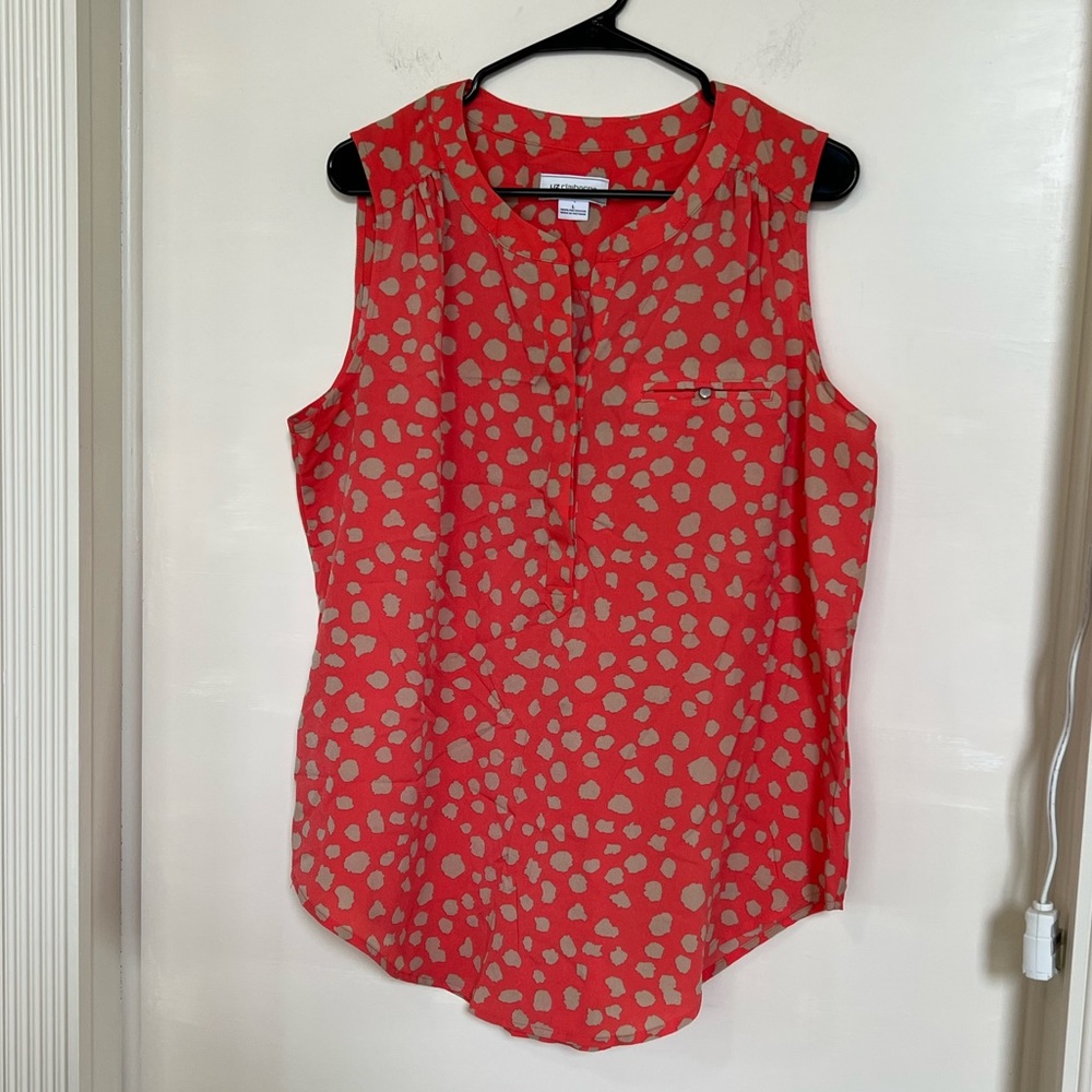 Orange and cream patterned sleeveless blouse